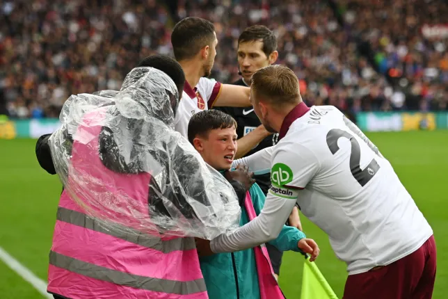 West Ham heroes save ball boy after celebrating fans crash through advertising boards