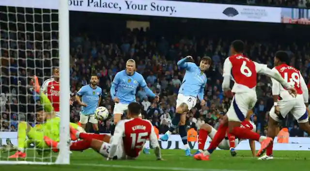 Late injury time goal by John Stones rescues Manchester City in clash with Arsenal